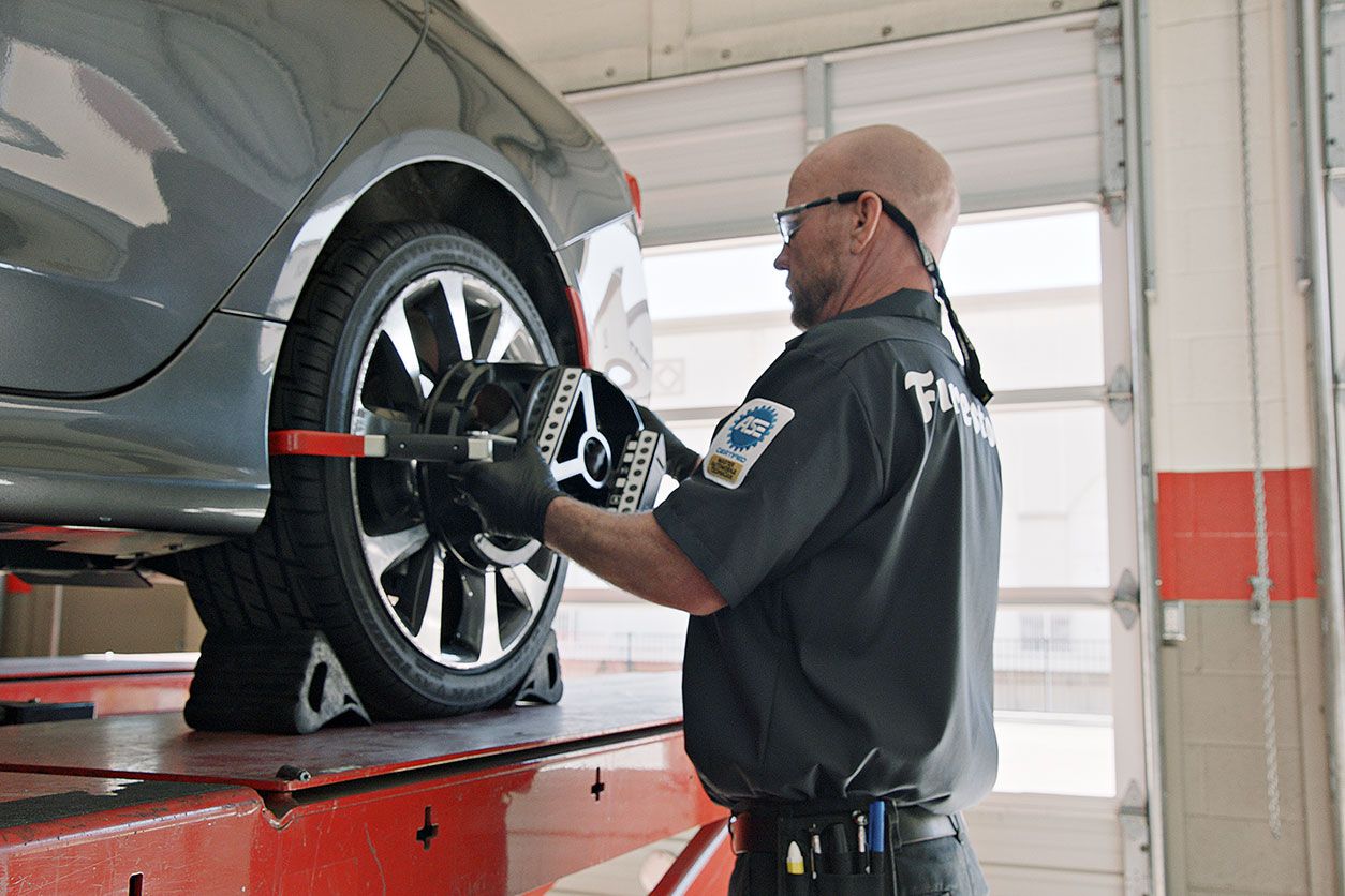 Wheel alignment on white car