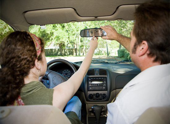 parent teaching teen to drive