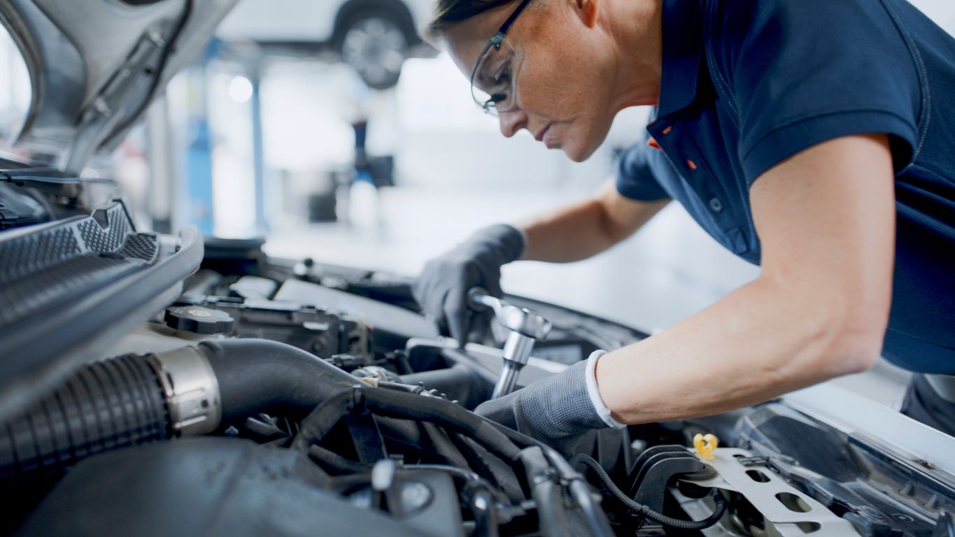 image of mechanic checking the car