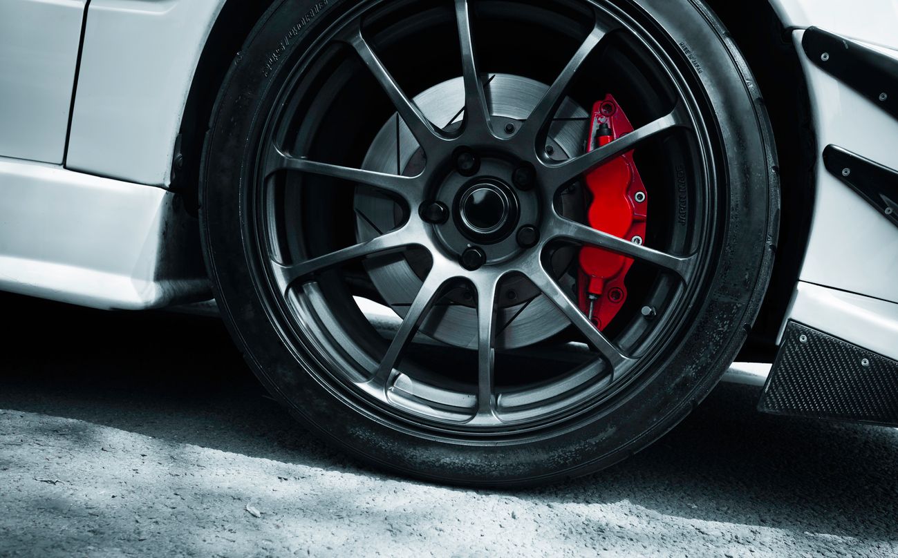 image of red car brake caliper