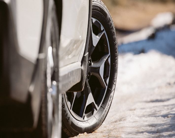 car tire parked on icy road