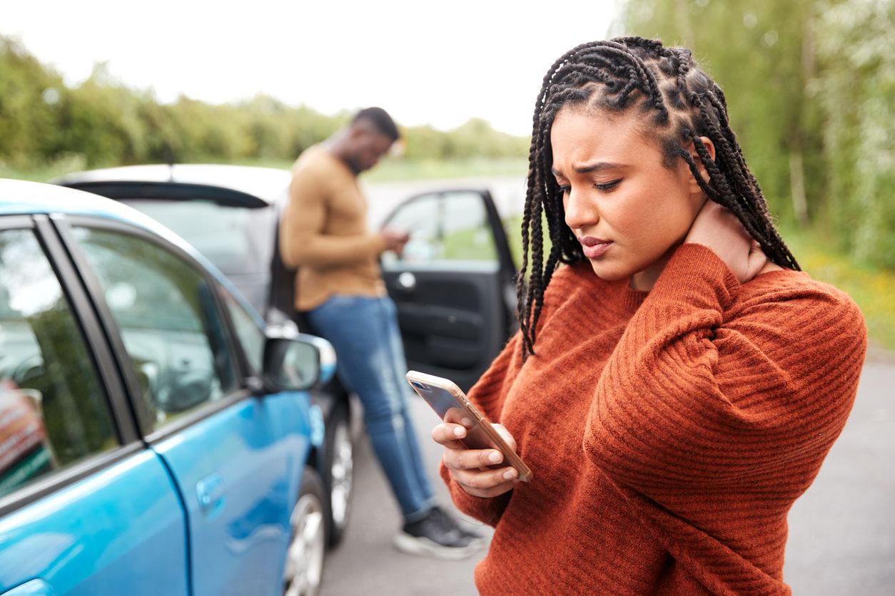 image of a woman calling for help after an accident